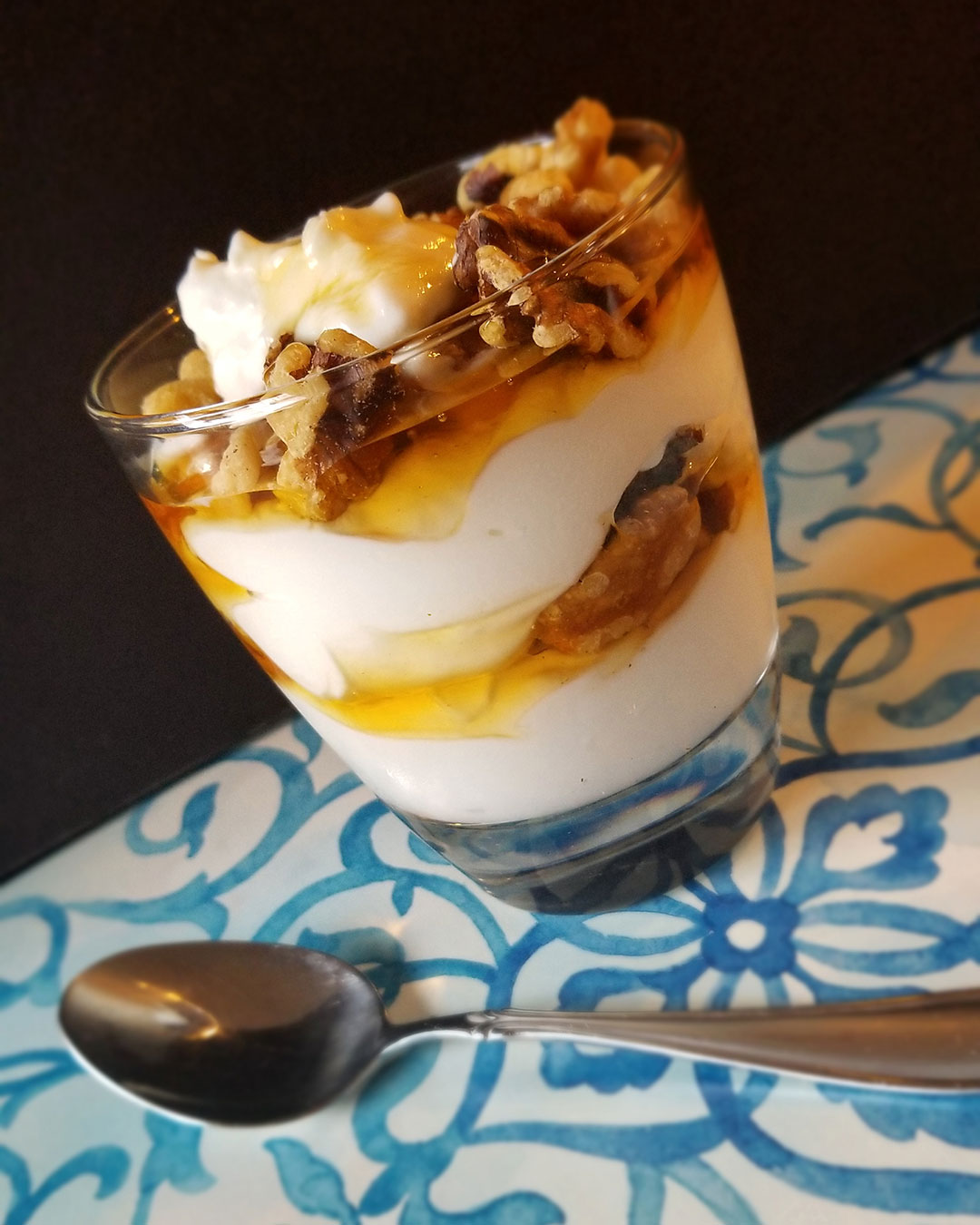 Greek yogurt layered with honey and walnuts