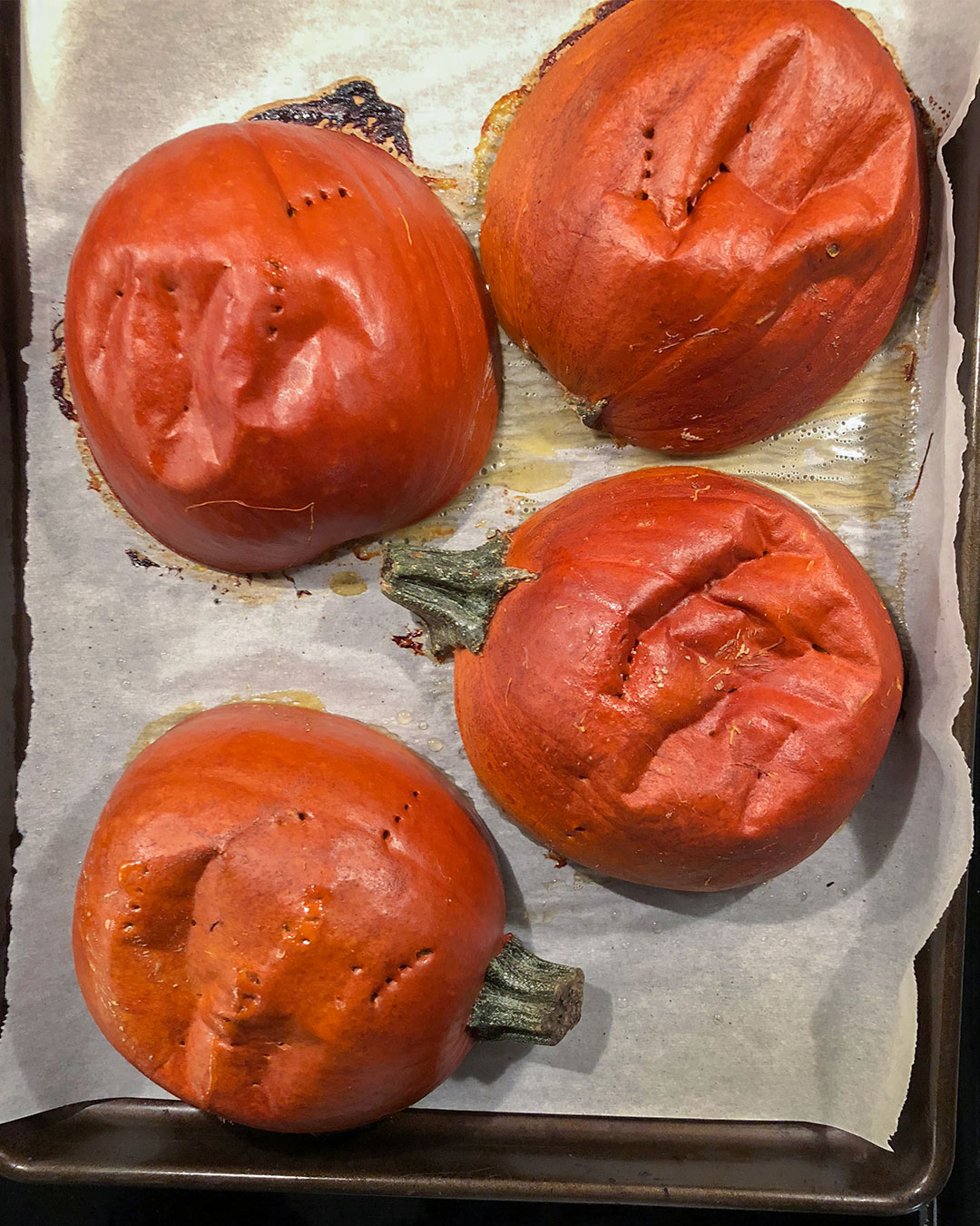 pumpkin pie pumpkins on a baking sheet after cooking in the oven