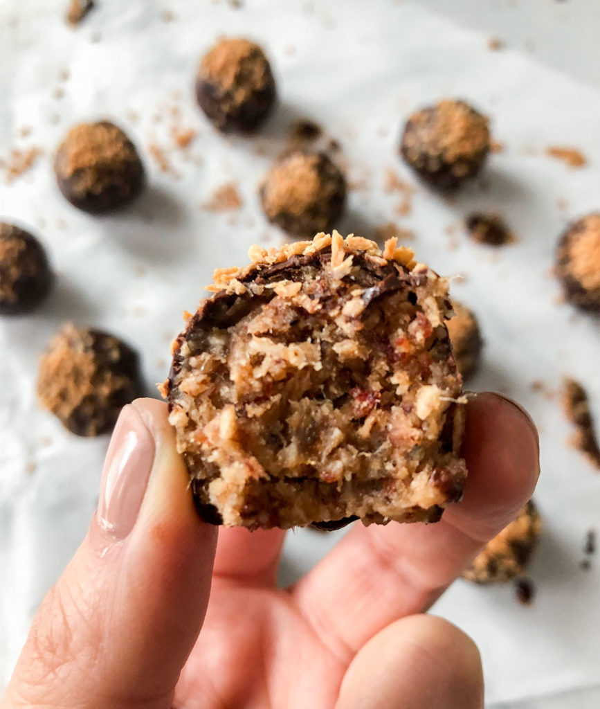 Samoas Truffles with a bite taken out of one