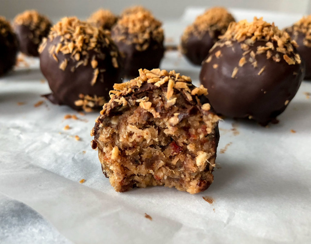Samoas Truffles covered in chocolate and topped with toasted coconut