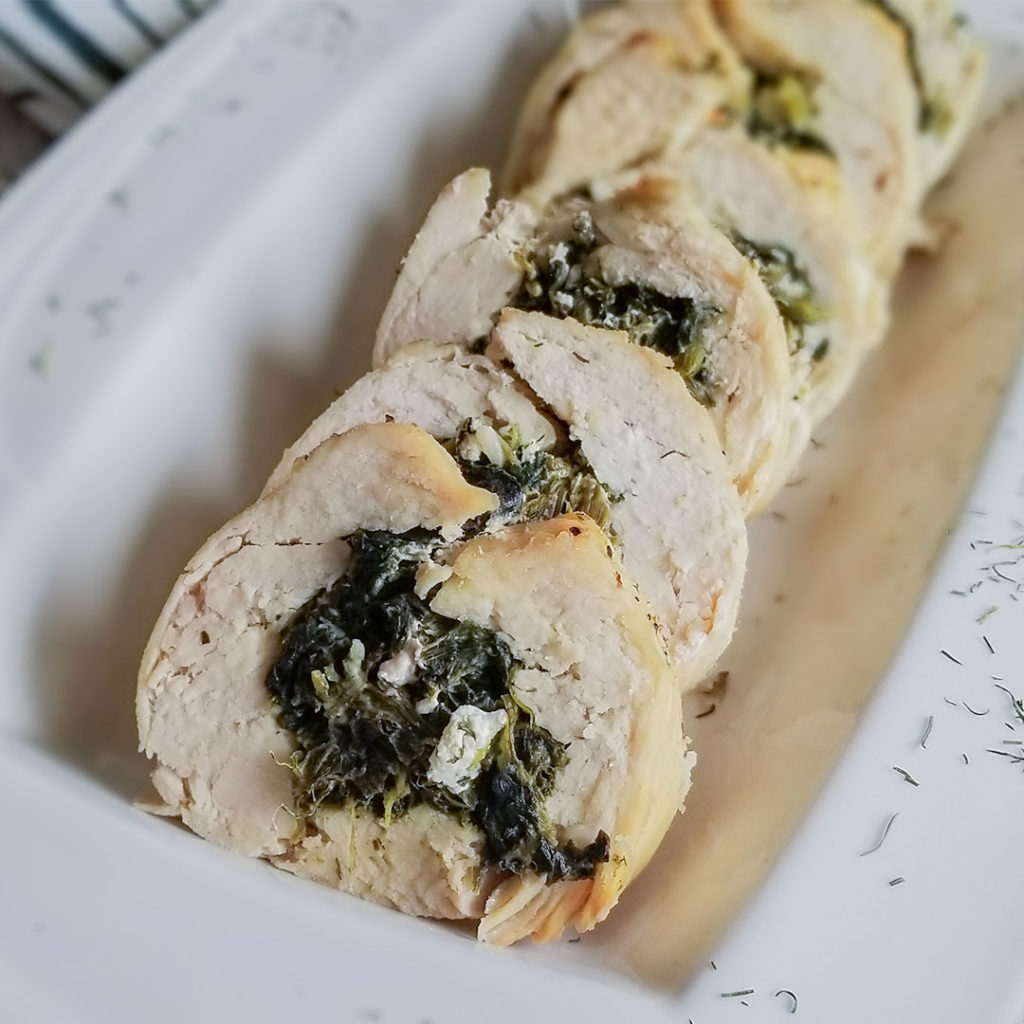 Spanakopita Stuffed Chicken on a serving plate