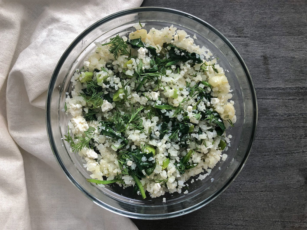 cauliflower rice with spinach, dill and feta cheese