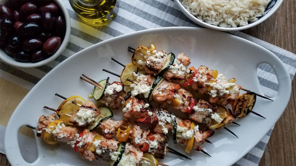 Grilled Greek Salmon Kebabs on a serving tray