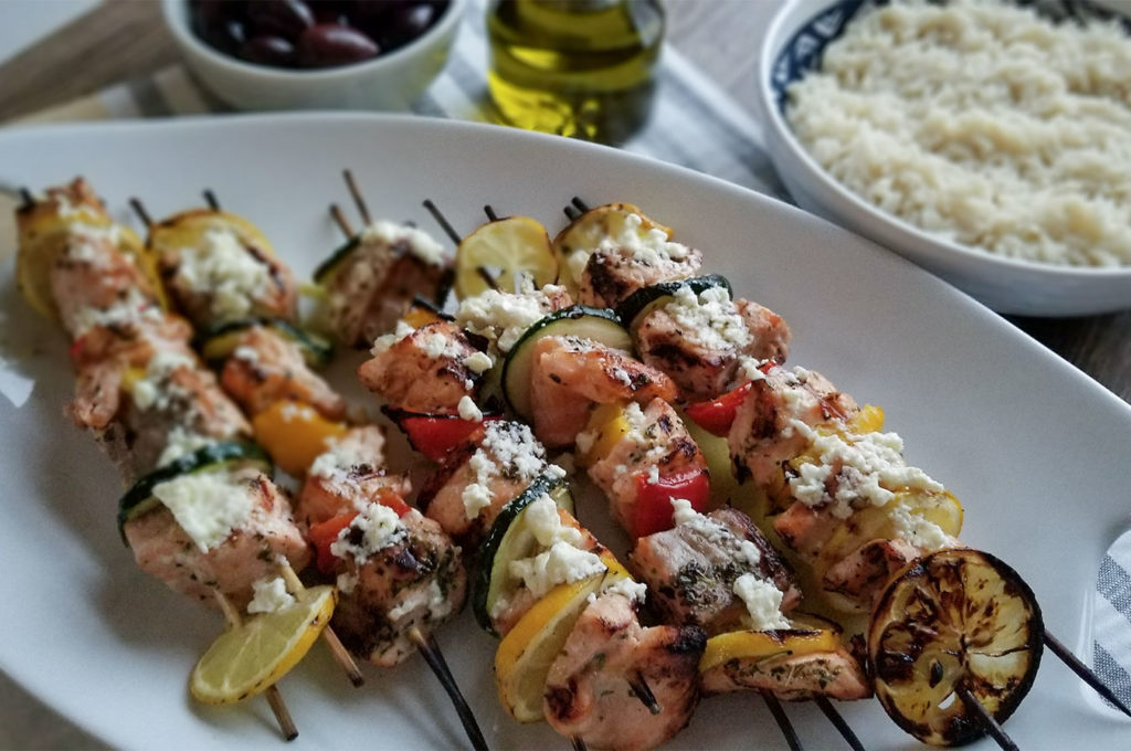 Grilled Greek Salmon Kebabs on a serving tray