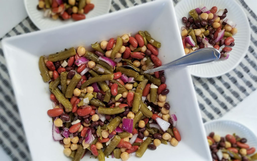 Bean Salad in a serving dish and on plates