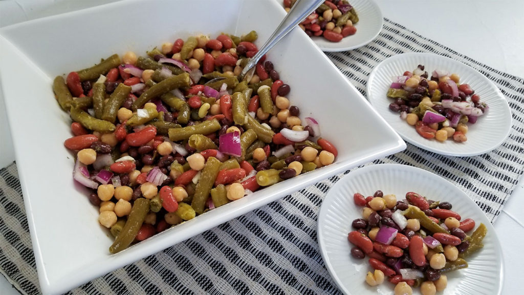 Bean Salad in a serving dish and on plates