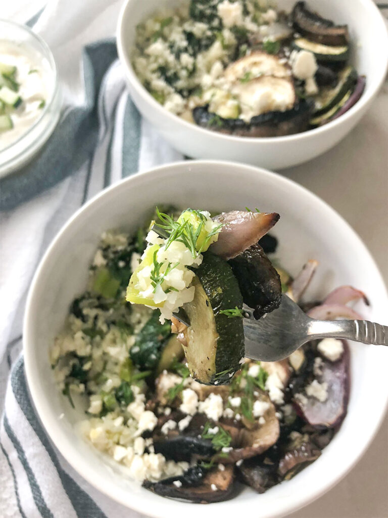 Greek Veggie Bowl with cauliflower rice and tzatziki sauce on the side