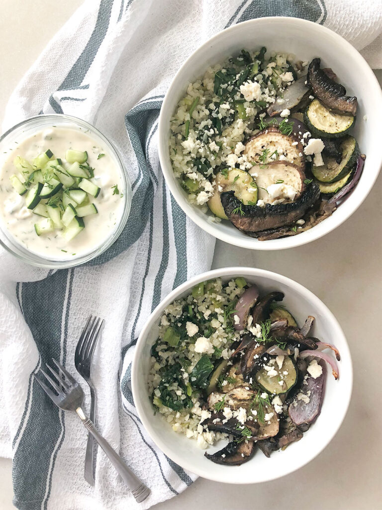 Greek Veggie Bowl with cauliflower rice and tzatziki sauce on the side