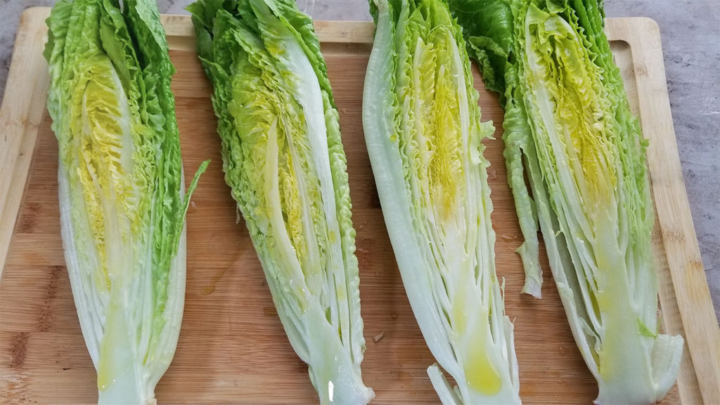 Romaine heads cut in half lengthwise