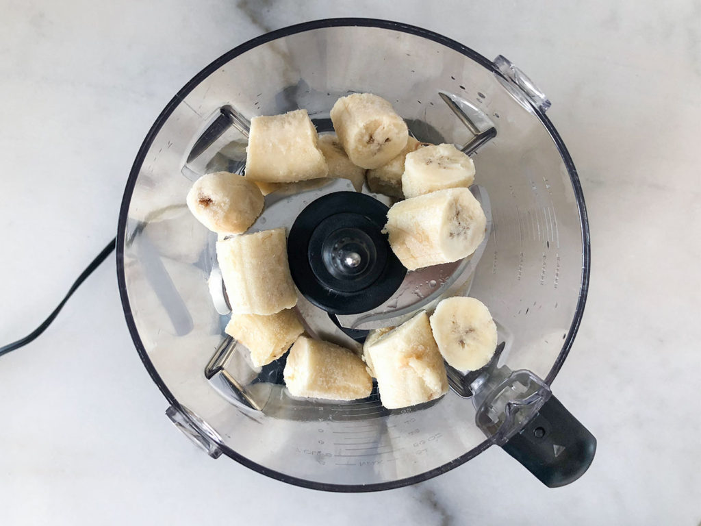 frozen banana chunks in a food processor