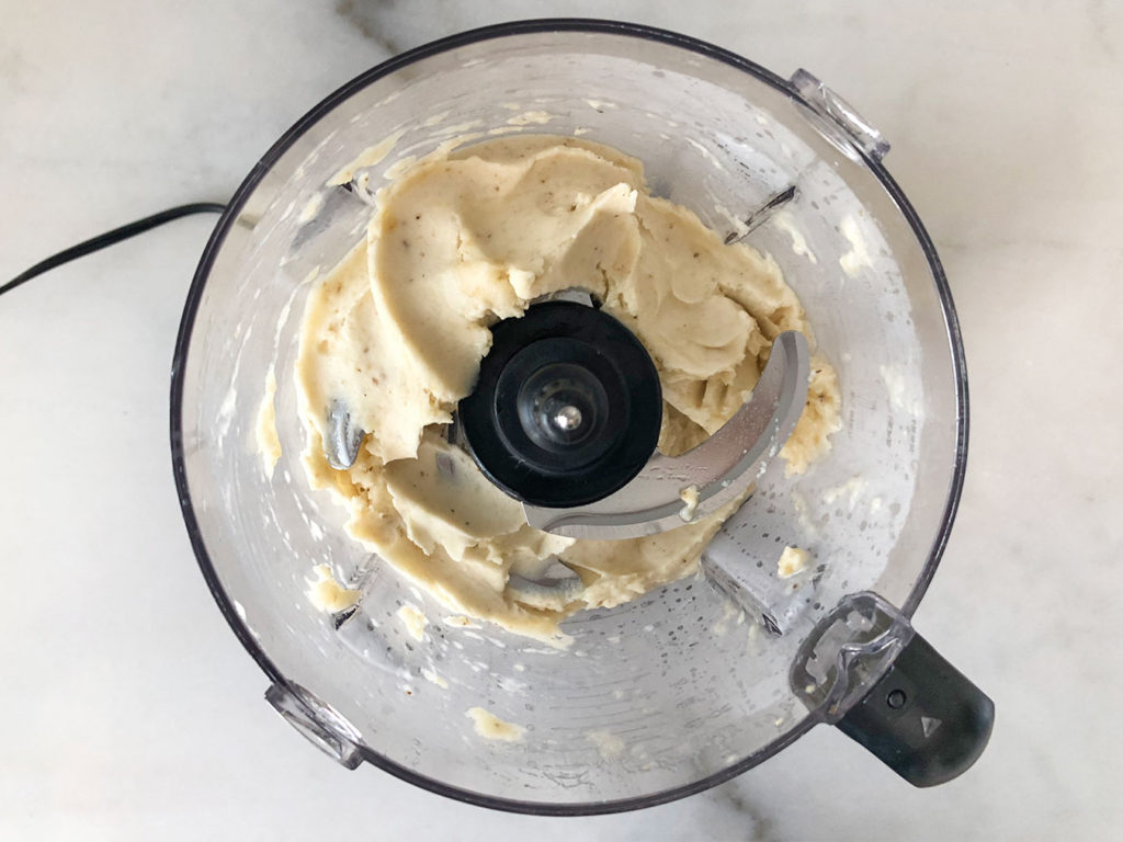 blended frozen banana chunks in a food processor