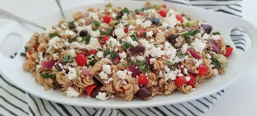 Greek pasta salad in a serving dish