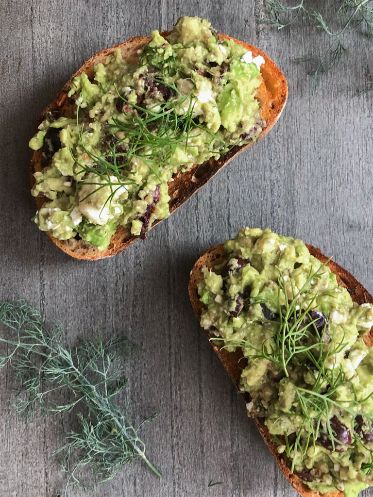 Greek-Style Avocado Toast topped with fresh dill