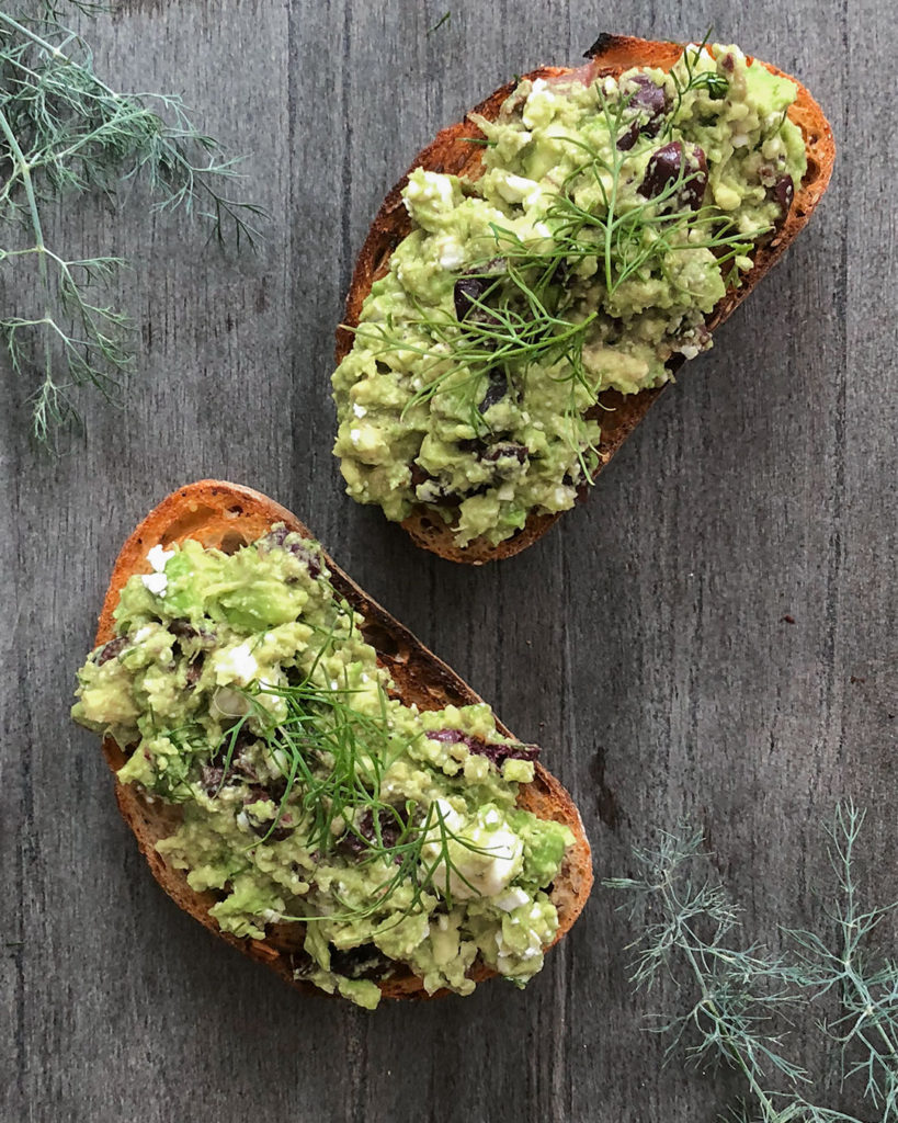 Greek-Style Avocado Toast topped with fresh dill