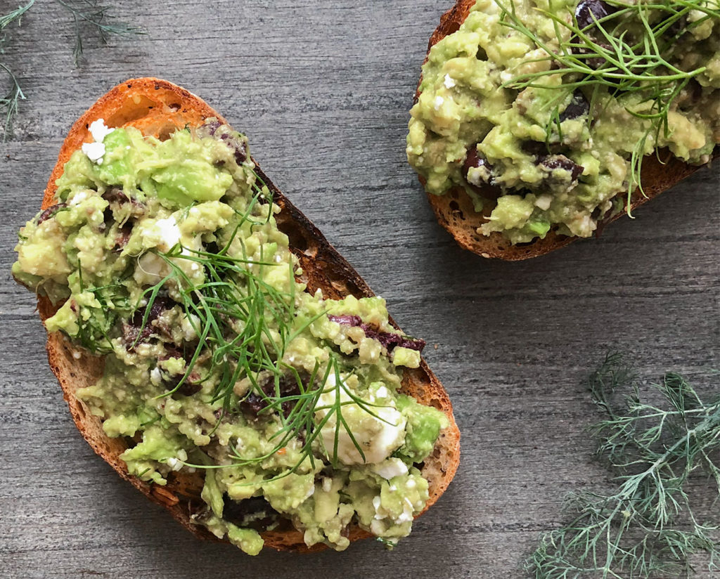 Greek-Style Avocado Toast topped with fresh dill