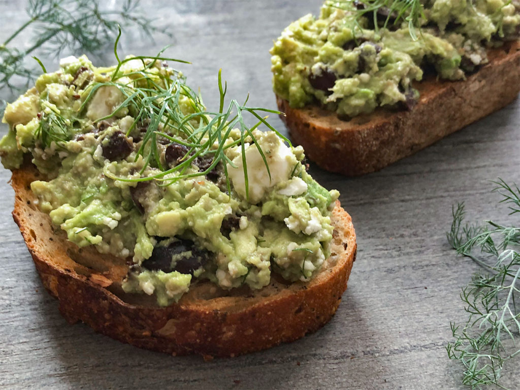 Greek-Style Avocado Toast topped with fresh dill