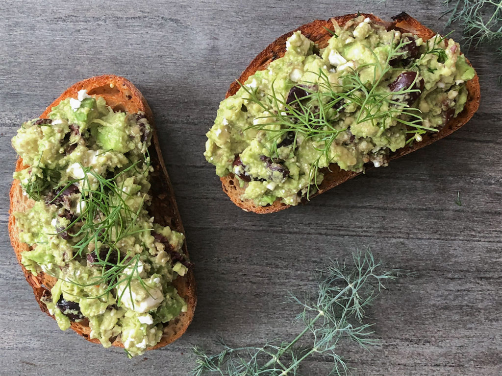 Greek-Style Avocado Toast topped with fresh dill