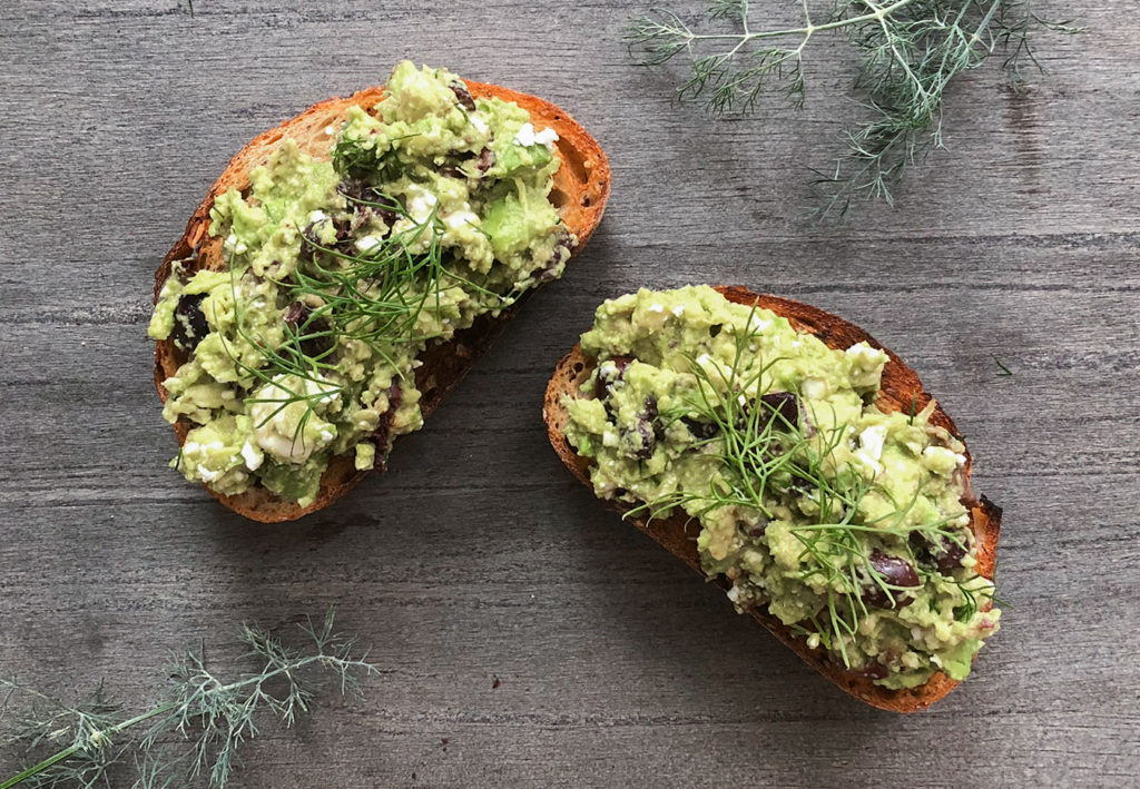 Greek-Style Avocado Toast topped with fresh dill