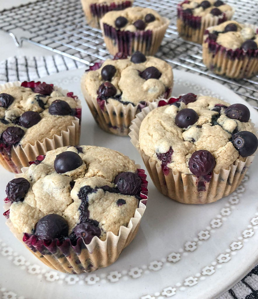 Blueberry Muffins on a plate and a cooling rack