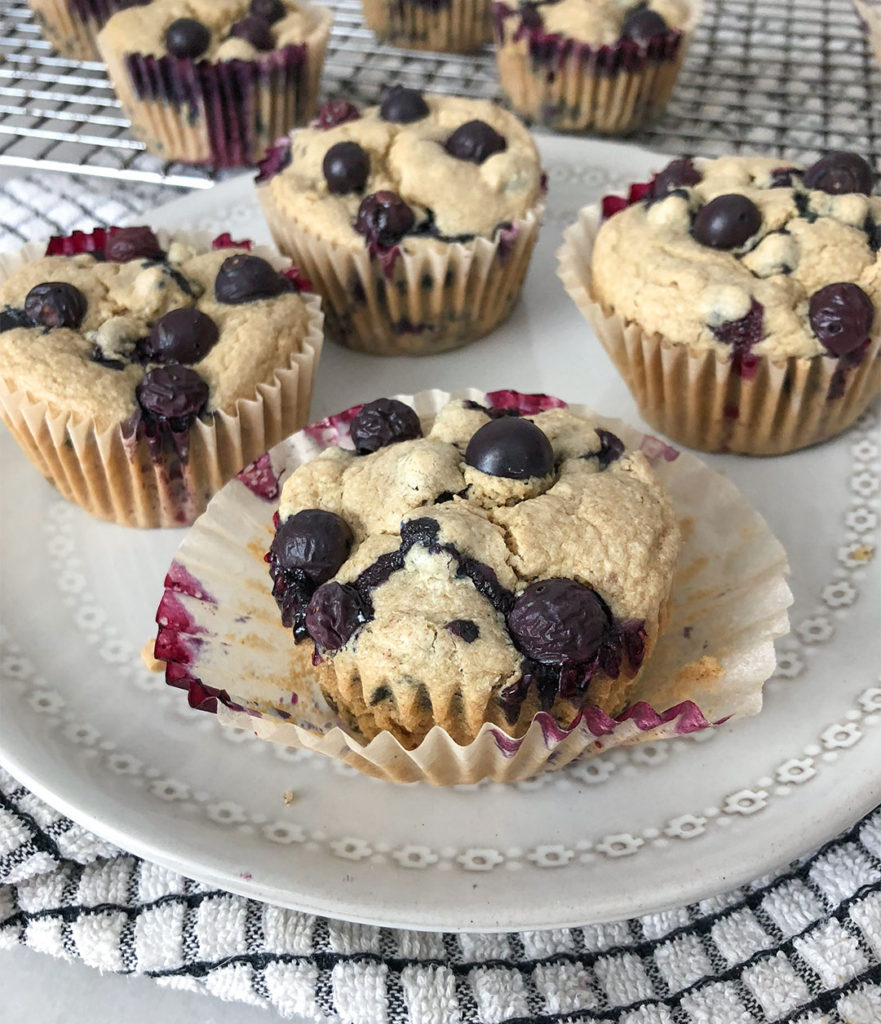 Blueberry Muffins on a plate and a cooling rack