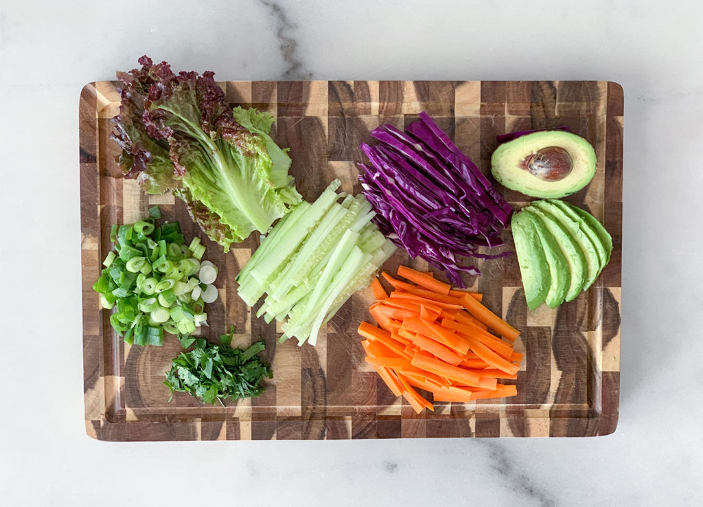 Vegetable Summer Rolls ingredients prepared on a cutting board