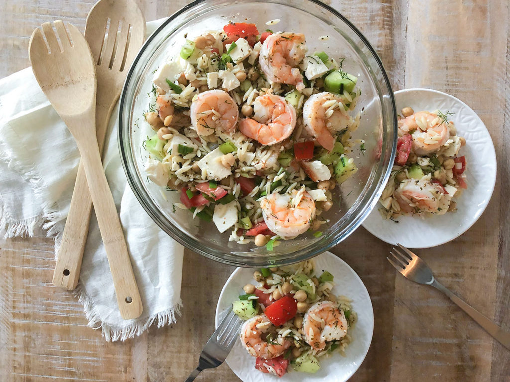  Mediterranean Shrimp & Orzo Salad in a serving bowl and on plates