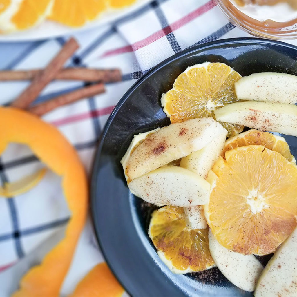 apples and oranges sliced with cinnamon and honey