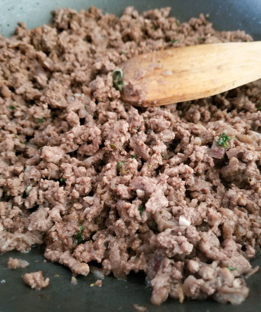 meat sautéing in a skillet