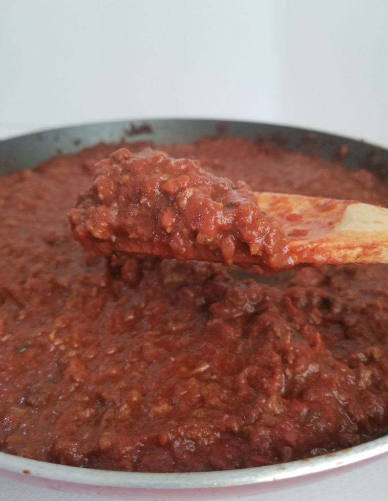 meat sauce cooking in a skillet