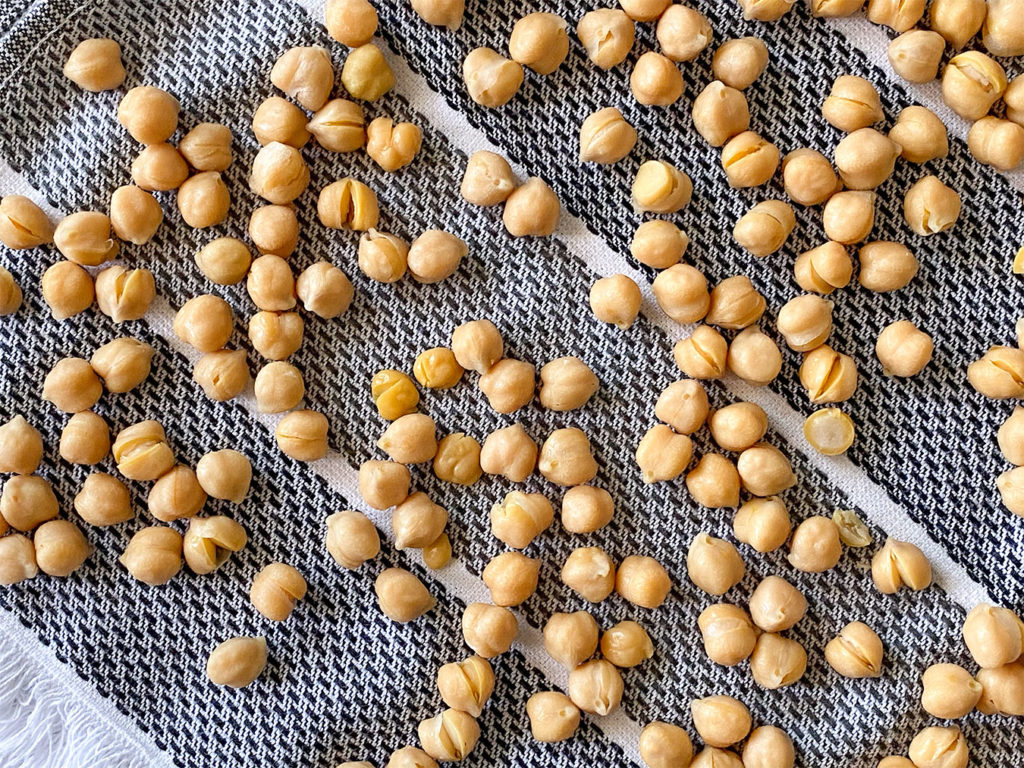 Rinsed chickpeas air drying on a towel