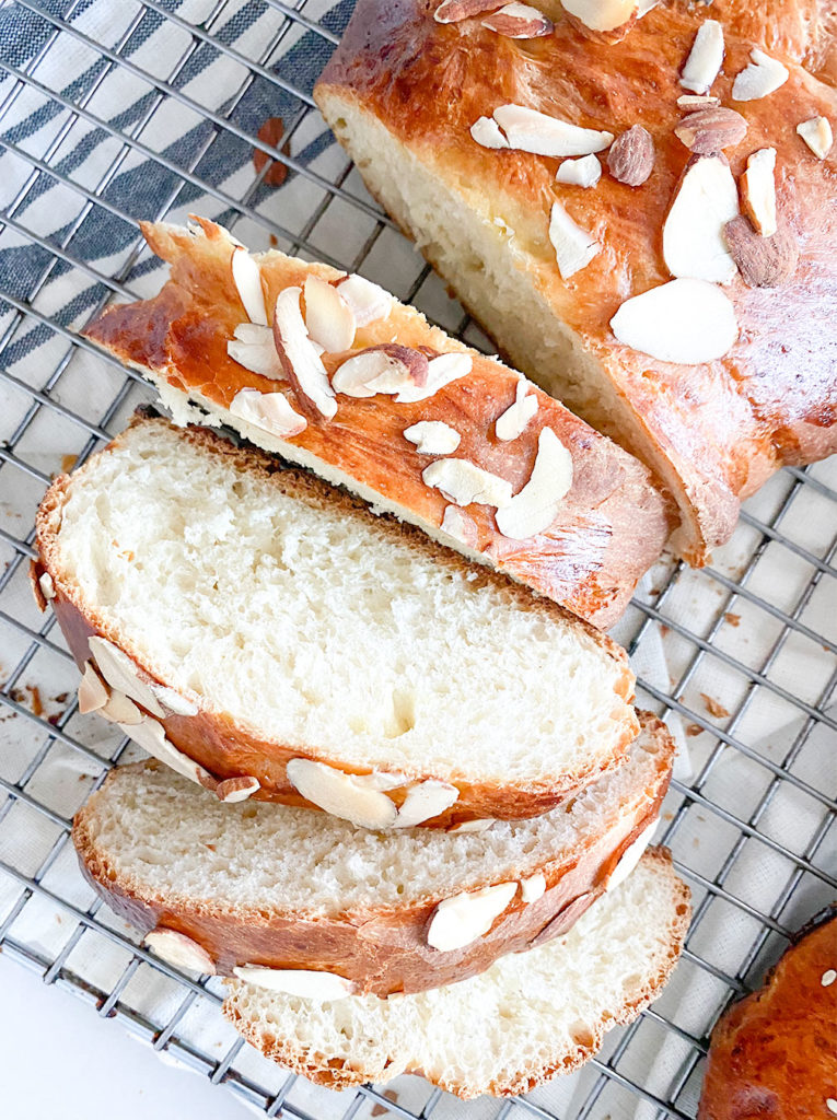 sliced tsoureki greek sweet bread on a cooling rack