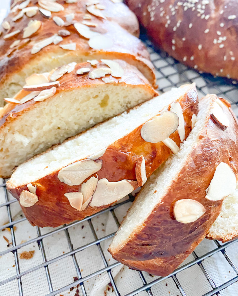 sliced tsoureki greek sweet bread on a cooling rack