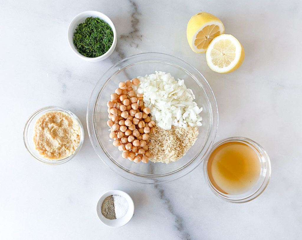 stuffing ingredients including lemon, rice, onion, chickpeas, broth, dill, salt and pepper