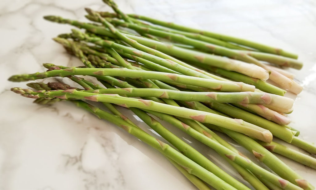 asparagus spears on a counter