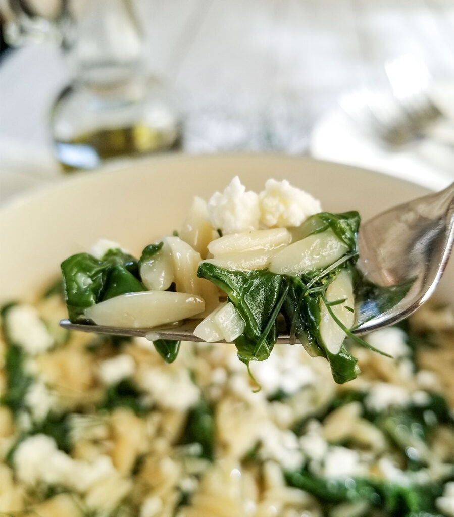 Mediterranean Orzo With Swiss Chard on a fork