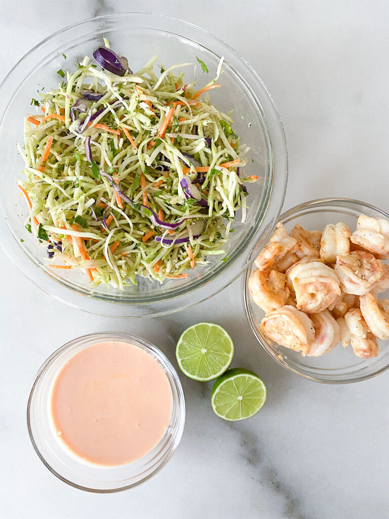 bang bang shrimp salad ingredients in separate bowls