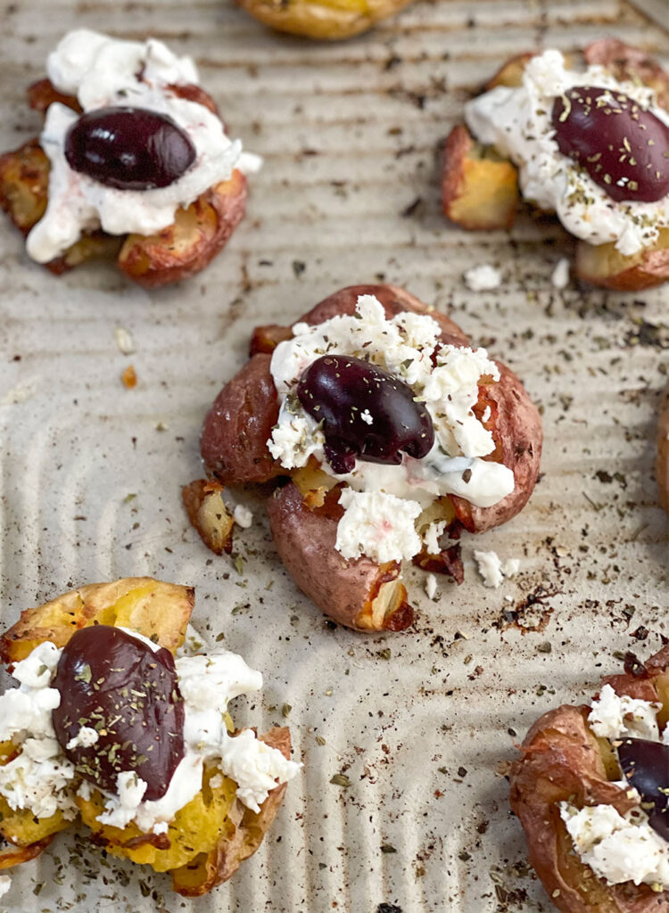 smashed potatoes on a baking sheet