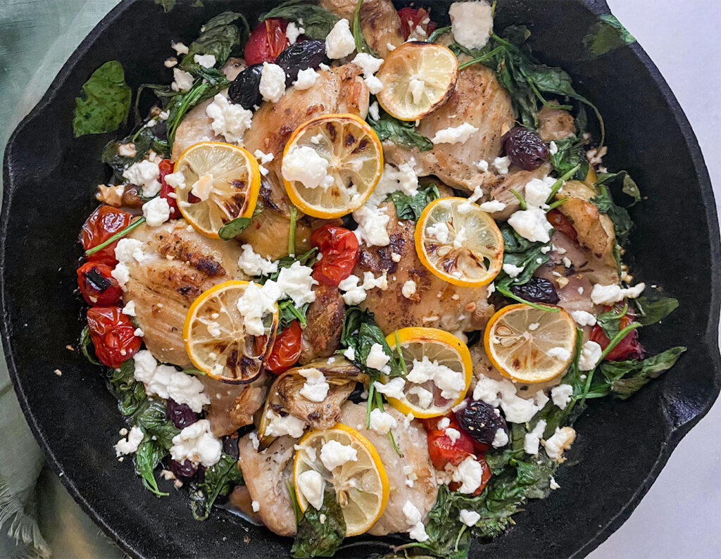 mediterranean chicken baked in a cast iron skillet