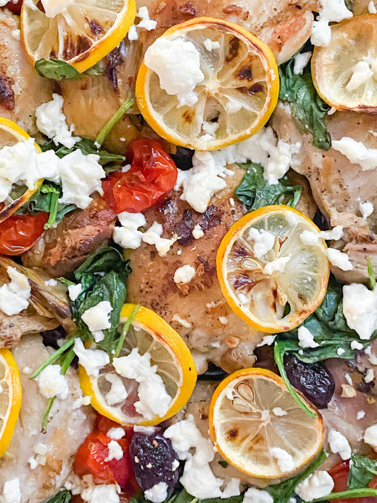 baked chicken thighs with tomatoes, spinach, olives, lemons and feta cheese