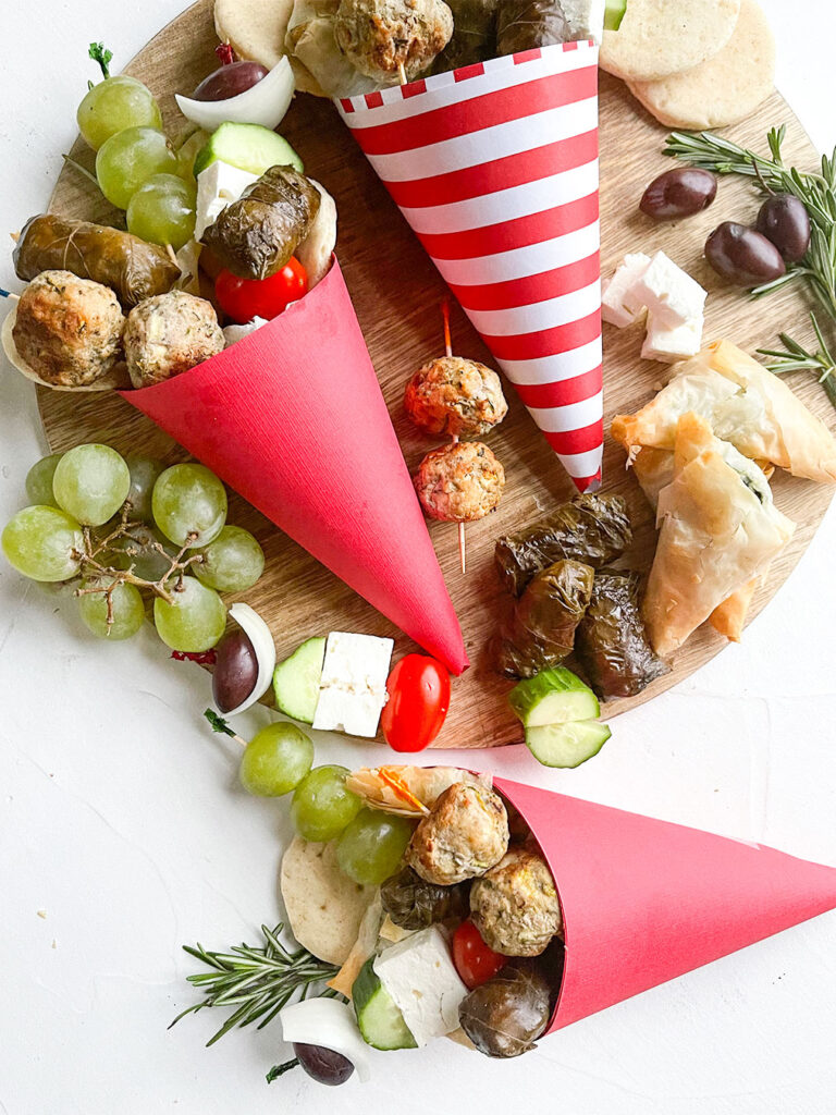 assorted mediterranean appetizers in paper cones