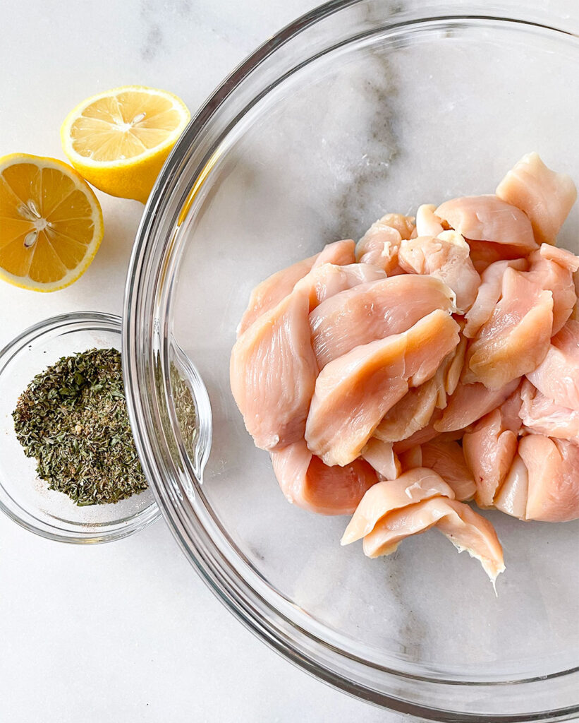 raw chicken, lemons and seasoning