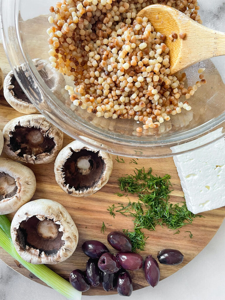 stuffed mushroom ingredients on a cutting board