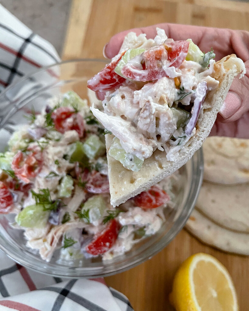 Greek chicken salad served on top of pita bread