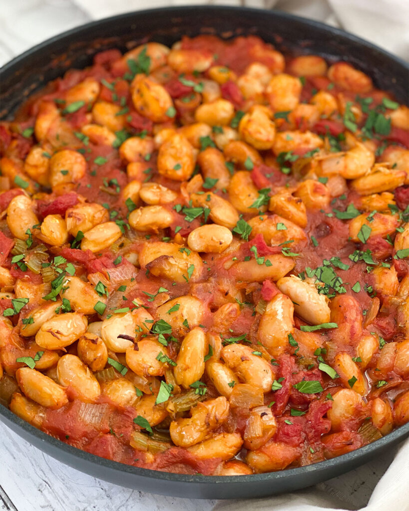 Greek Gigantes (Plaki) topped with fresh parsley