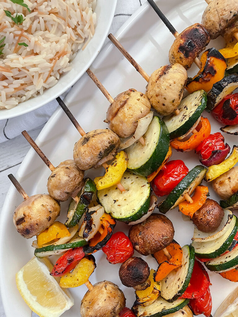 Grilled vegetable kebabs on a platter