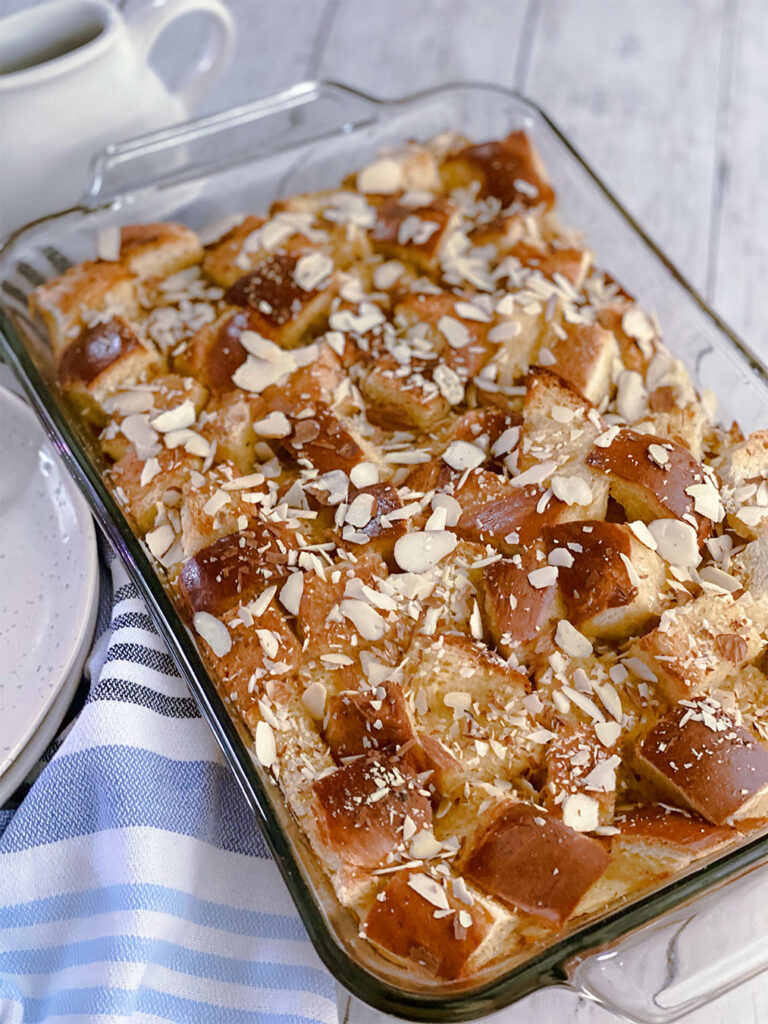 tsoureki french toast bake topped with almonds