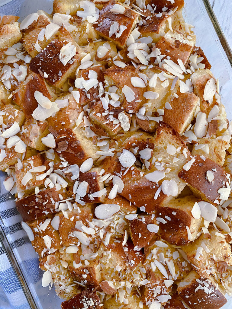 french toast bake made with tsoureki and topped with sliced almonds