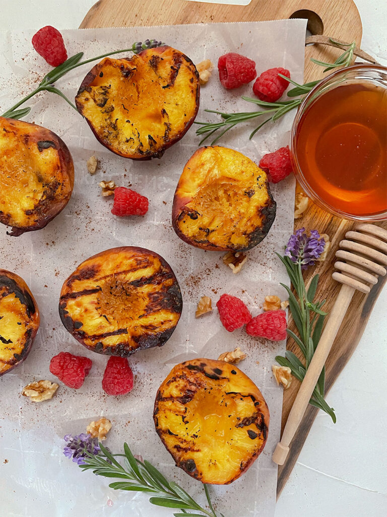 grilled peach halves with cinnamon and raspberries