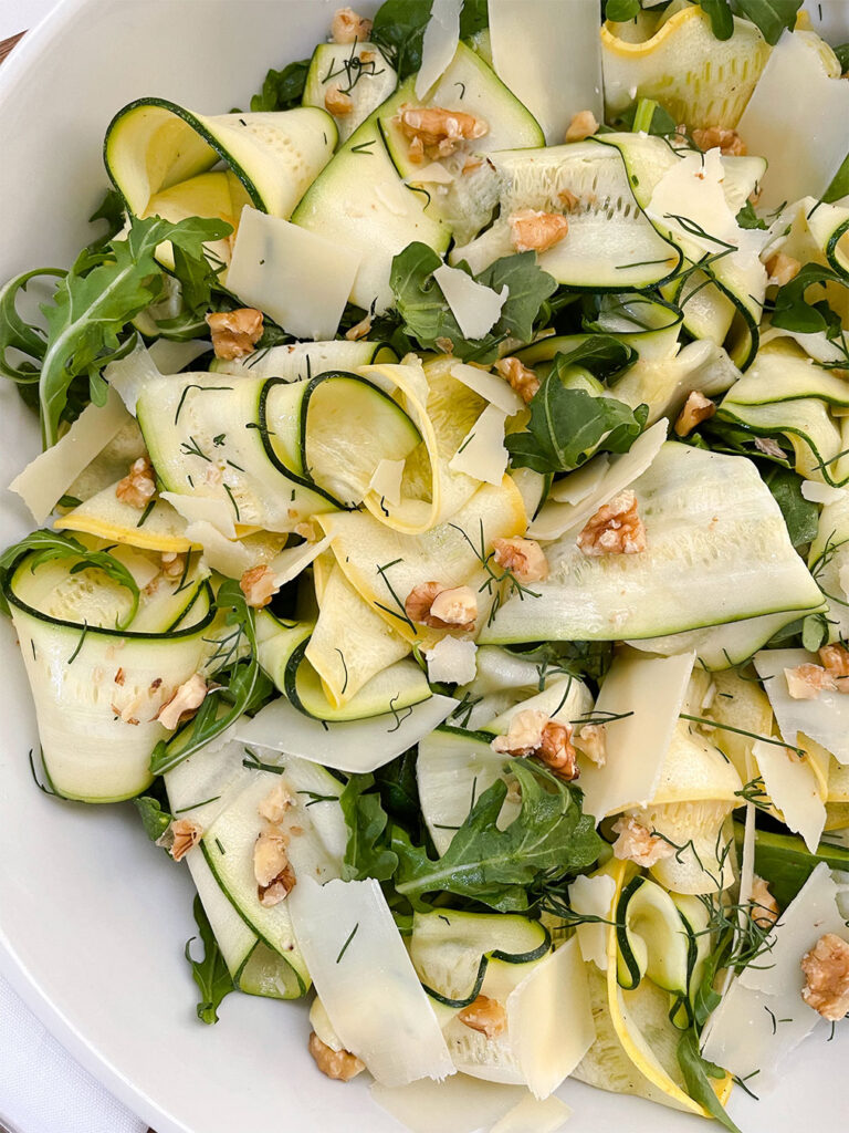 zucchini and squash ribbon salad with cheese and walnuts