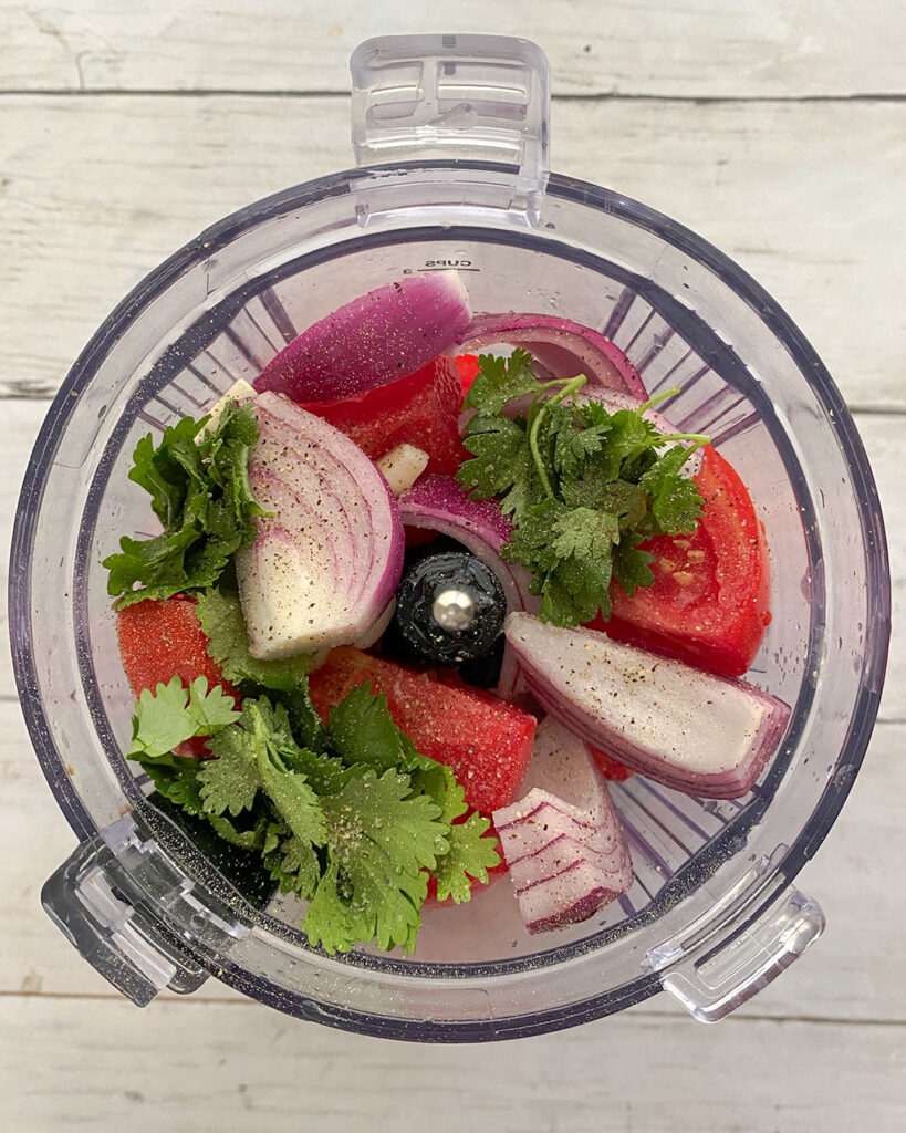 homemade salsa ingredients in a food processor